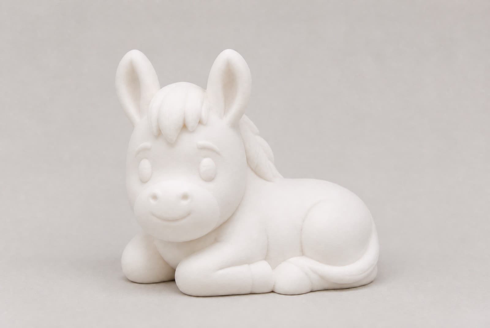 Burrito echado, figura blanca mate del set de animalitos